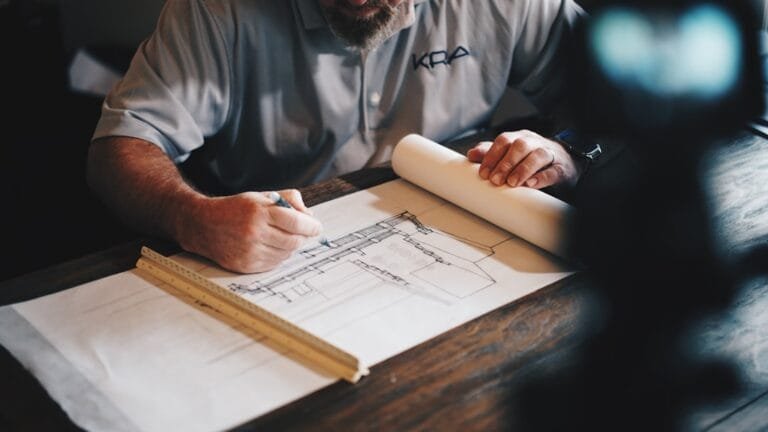 Engineering blueprint and drafting tools representing civil cartographer recruitment