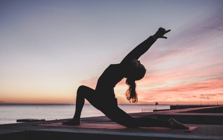 Person practicing yoga on a yoga mat